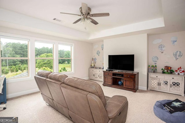 7345 Vale Ct, Cumming, GA 30028 - living area with light colored carpet, baseboards, ceiling fan, a tray ceiling, and plenty of natural light