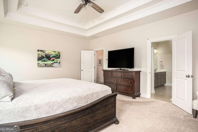 7345 Vale Ct, Cumming, GA 30028 - bedroom featuring a raised ceiling, ornamental molding, light carpet, connected bathroom, and a ceiling fan