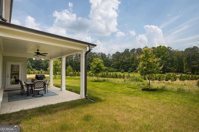 7345 Vale Ct, Cumming, GA 30028 - view of green lawn with ceiling fan and a patio