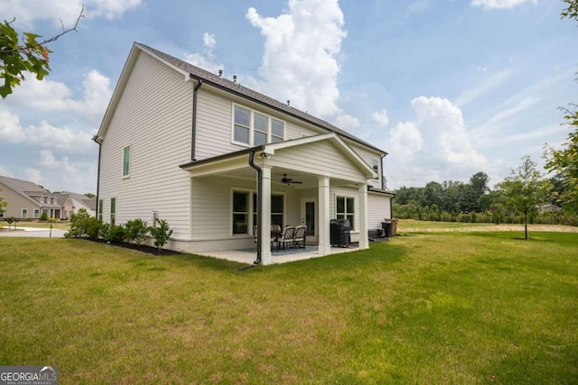 7345 Vale Ct, Cumming, GA 30028 - back of property with a ceiling fan, a lawn, and a patio area