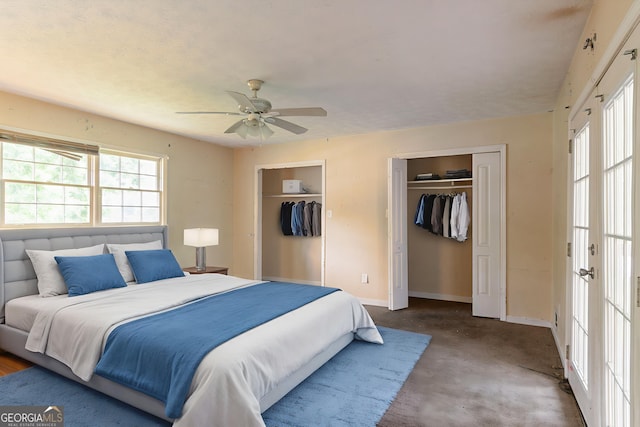 4715 Wildginger Run, Lithonia, GA 30038 - bedroom featuring two closets, carpet flooring, baseboards, and ceiling fan