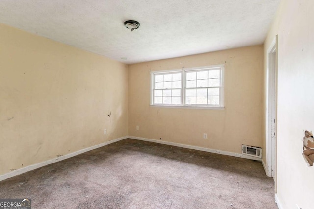 4715 Wildginger Run, Lithonia, GA 30038 - empty room with carpet, baseboards, and a textured ceiling