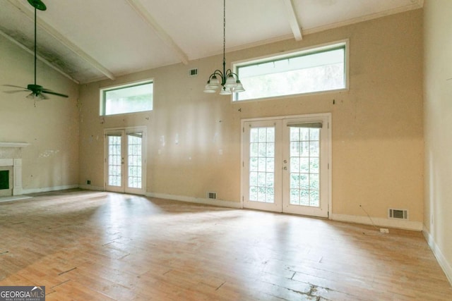 4715 Wildginger Run, Lithonia, GA 30038 - unfurnished living room featuring high vaulted ceiling, french doors, beamed ceiling, wood-type flooring, and a ceiling fan