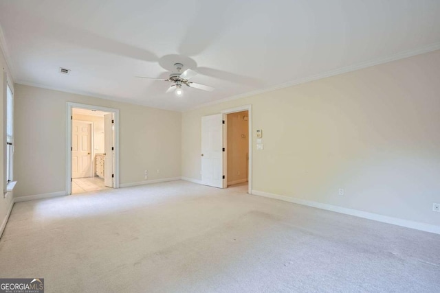 7155 Roswell Rd Unit 58, Atlanta, GA 30328 - empty room with ceiling fan, crown molding, baseboards, and light colored carpet