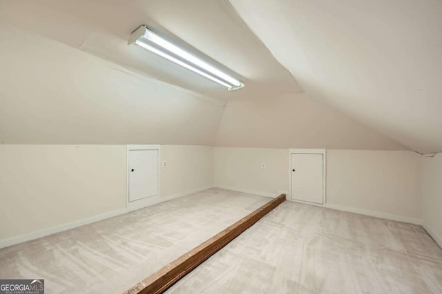 7155 Roswell Rd Unit 58, Atlanta, GA 30328 - additional living space with light carpet, vaulted ceiling, and baseboards