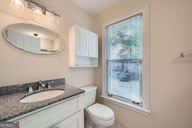 7155 Roswell Rd Unit 58, Atlanta, GA 30328 - half bathroom featuring toilet and vanity