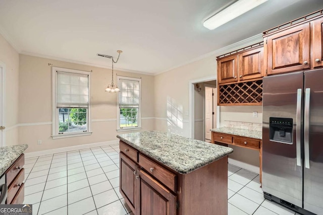 7155 Roswell Rd Unit 58, Atlanta, GA 30328 - kitchen with stainless steel fridge, light tile patterned flooring, brown cabinets, a chandelier, and ornamental molding