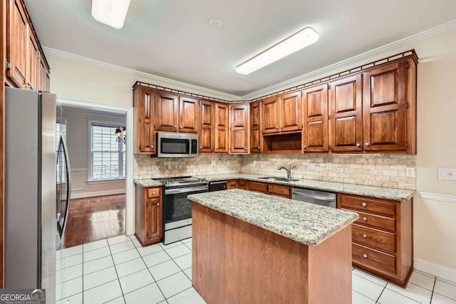 7155 Roswell Rd Unit 58, Atlanta, GA 30328 - kitchen featuring appliances with stainless steel finishes, a sink, light tile patterned floors, tasteful backsplash, and ornamental molding
