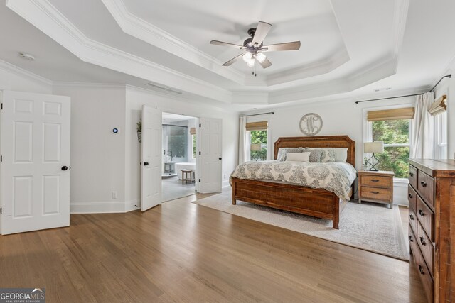 712 Brookshade Pkwy, Alpharetta, GA 30004 - bedroom with a raised ceiling, multiple windows, wood finished floors, crown molding, and baseboards