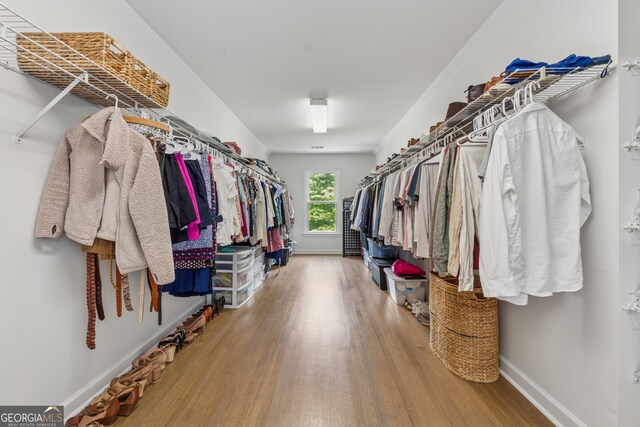 712 Brookshade Pkwy, Alpharetta, GA 30004 - walk in closet with wood finished floors