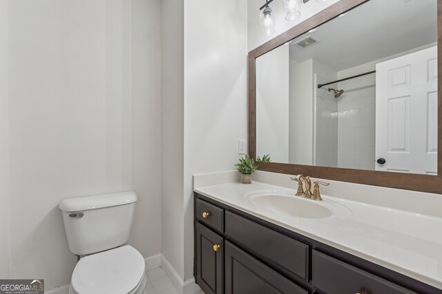 712 Brookshade Pkwy, Alpharetta, GA 30004 - full bathroom with toilet, vanity, baseboards, and a shower