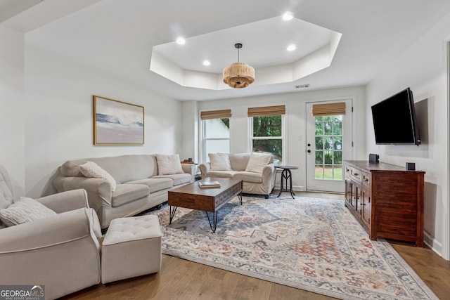 712 Brookshade Pkwy, Alpharetta, GA 30004 - living room with a raised ceiling, wood finished floors, recessed lighting, and baseboards