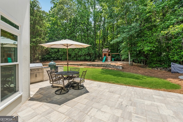 712 Brookshade Pkwy, Alpharetta, GA 30004 - view of patio / terrace featuring a playground, area for grilling, and outdoor dining area