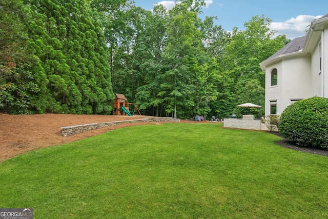 712 Brookshade Pkwy, Alpharetta, GA 30004 - view of grassy yard with a playground