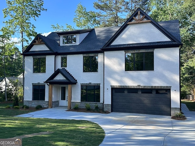 4955 Chamblee Dunwoody Rd, Dunwoody, GA 30338 - view of front facade with an attached garage, concrete driveway, a front lawn, brick siding, and stone siding