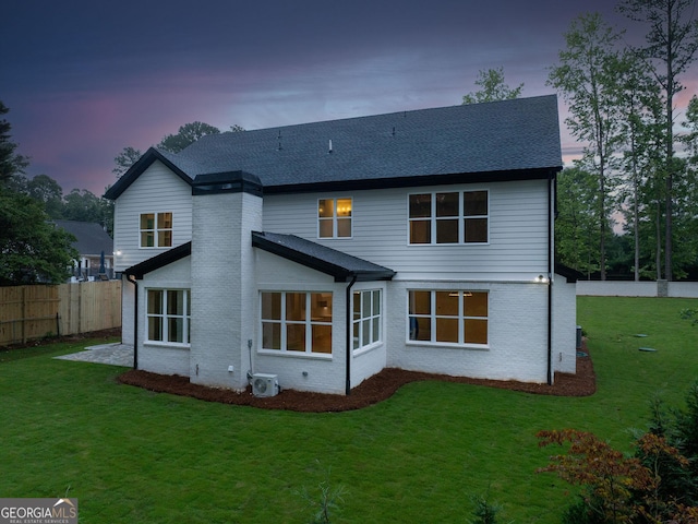 4955 Chamblee Dunwoody Rd, Dunwoody, GA 30338 - back of property at dusk featuring brick siding and a shingled roof