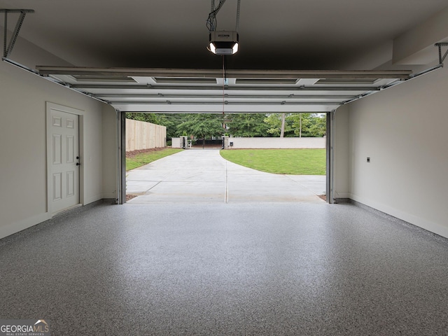 4955 Chamblee Dunwoody Rd, Dunwoody, GA 30338 - garage with a garage door opener and baseboards