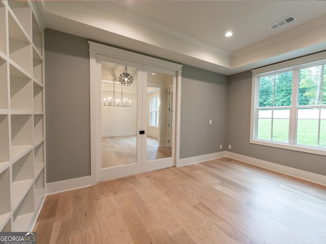 4955 Chamblee Dunwoody Rd, Dunwoody, GA 30338 - unfurnished room featuring a chandelier, light wood-style floors, and recessed lighting