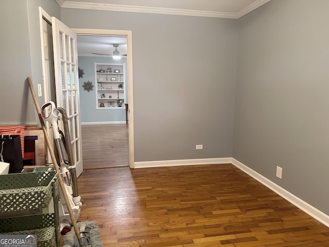 746 Thomas Rd, Trion, GA 30753 - spare room featuring crown molding, wood finished floors, and built in shelves