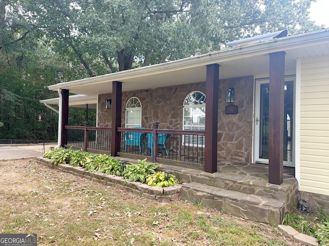 746 Thomas Rd, Trion, GA 30753 - doorway to property with covered porch and stone siding