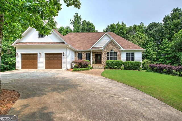 1488 Pleasant Hill Rd NE, Ranger, GA 30734 - view of front of house with driveway, a garage, and a front yard