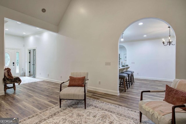 1488 Pleasant Hill Rd NE, Ranger, GA 30734 - living area featuring arched walkways, wood finished floors, crown molding, baseboards, and recessed lighting