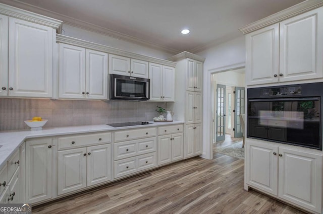 1488 Pleasant Hill Rd NE, Ranger, GA 30734 - kitchen featuring black appliances, backsplash, light wood finished floors, light countertops, and recessed lighting