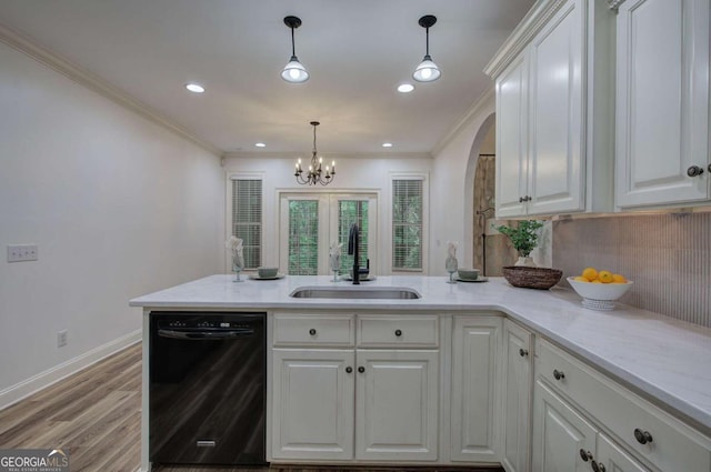 1488 Pleasant Hill Rd NE, Ranger, GA 30734 - kitchen featuring black dishwasher, a sink, a peninsula, ornamental molding, and white cabinetry