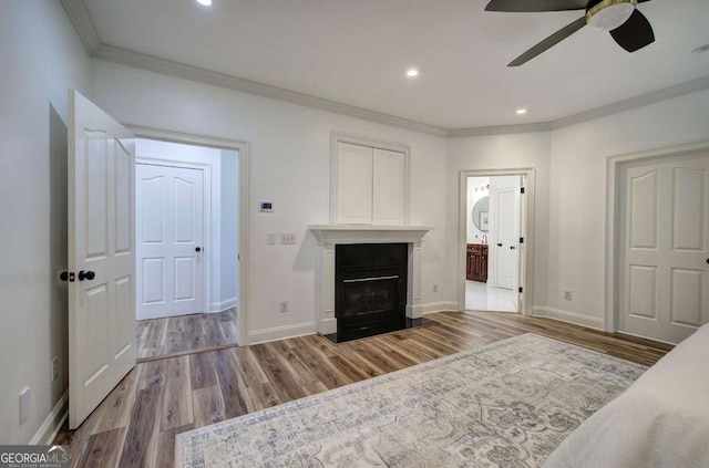 1488 Pleasant Hill Rd NE, Ranger, GA 30734 - bedroom featuring ornamental molding, wood finished floors, baseboards, a fireplace, and ensuite bath