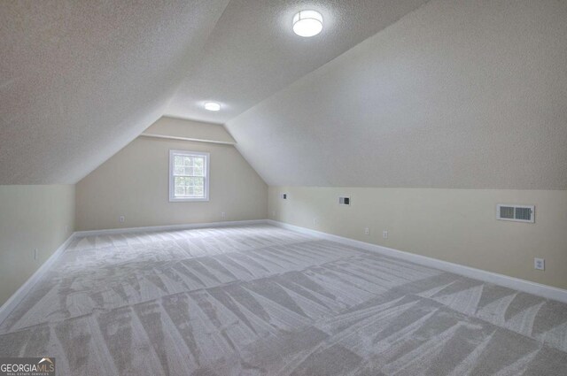 1488 Pleasant Hill Rd NE, Ranger, GA 30734 - bonus room featuring a textured ceiling, carpet flooring, baseboards, and vaulted ceiling