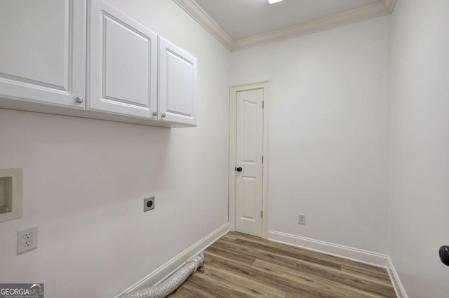 1488 Pleasant Hill Rd NE, Ranger, GA 30734 - washroom featuring hookup for an electric dryer, cabinet space, ornamental molding, baseboards, and wood finished floors