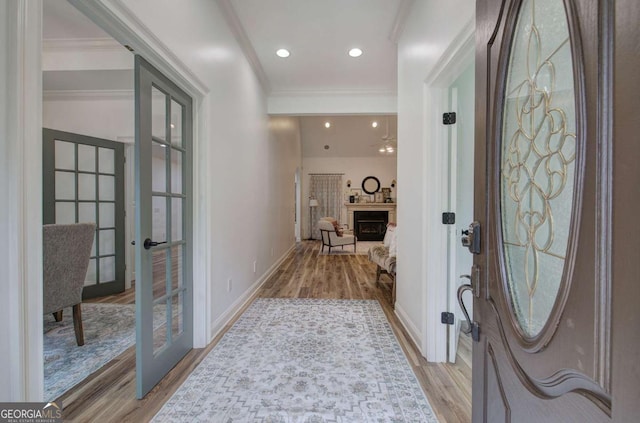 1488 Pleasant Hill Rd NE, Ranger, GA 30734 - entryway with french doors, light wood finished floors, a fireplace, crown molding, and baseboards