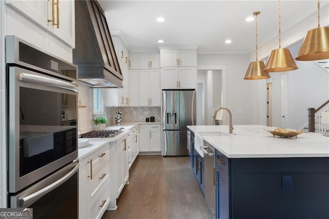 2602 Drew Valley Rd NE, Brookhaven, GA 30319 - kitchen featuring stainless steel appliances, blue cabinetry, light countertops, white cabinetry, and recessed lighting