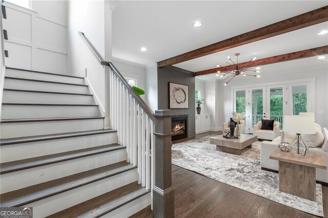 2602 Drew Valley Rd NE, Brookhaven, GA 30319 - living area featuring stairs, dark wood-type flooring, beamed ceiling, recessed lighting, and french doors