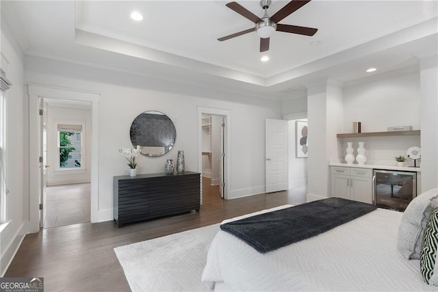 2602 Drew Valley Rd NE, Brookhaven, GA 30319 - bedroom featuring wine cooler, a tray ceiling, wood finished floors, recessed lighting, and ceiling fan