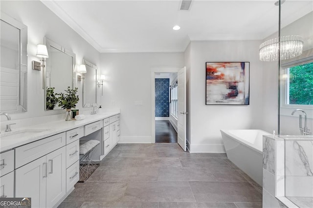 2602 Drew Valley Rd NE, Brookhaven, GA 30319 - bathroom featuring double vanity, a soaking tub, ornamental molding, a chandelier, and recessed lighting