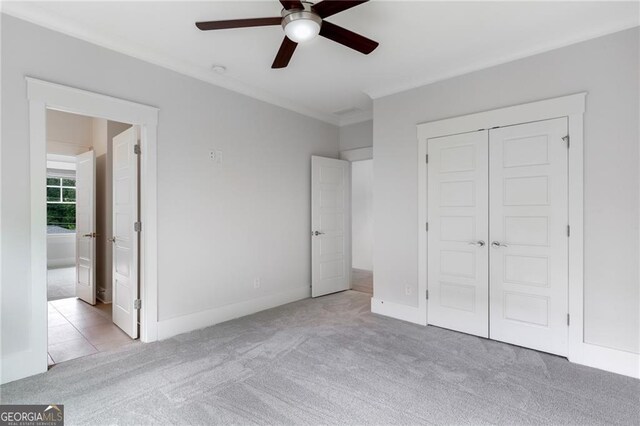 2602 Drew Valley Rd NE, Brookhaven, GA 30319 - unfurnished bedroom featuring carpet flooring, a closet, crown molding, ensuite bath, and ceiling fan