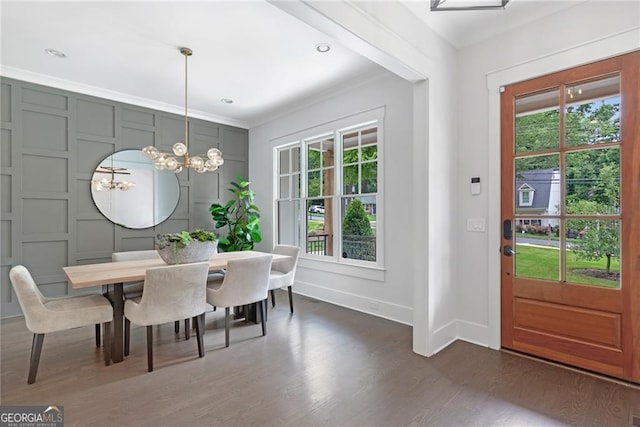 2602 Drew Valley Rd NE, Brookhaven, GA 30319 - dining area with dark wood-style floors, plenty of natural light, a chandelier, and crown molding