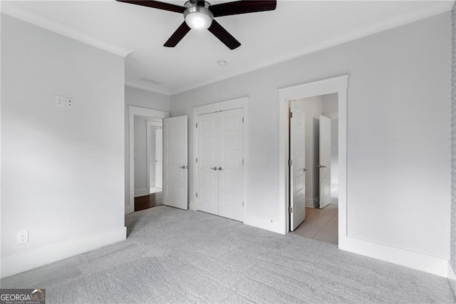 2602 Drew Valley Rd NE, Brookhaven, GA 30319 - unfurnished bedroom with light colored carpet, ornamental molding, a closet, ceiling fan, and ensuite bathroom