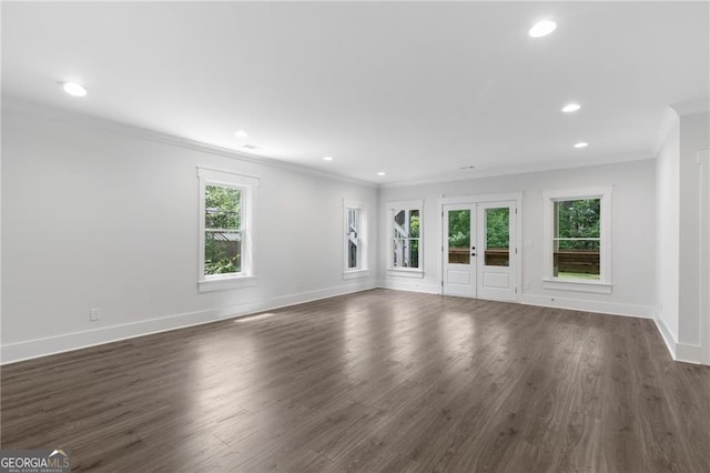 2602 Drew Valley Rd NE, Brookhaven, GA 30319 - empty room featuring ornamental molding, healthy amount of natural light, dark wood-type flooring, recessed lighting, and french doors