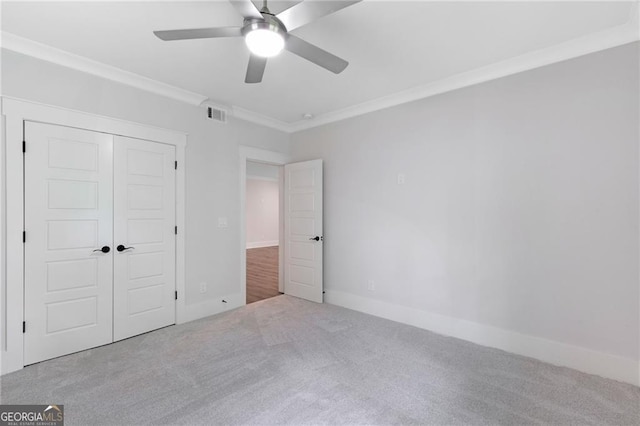 2602 Drew Valley Rd NE, Brookhaven, GA 30319 - unfurnished bedroom with carpet floors, ornamental molding, a closet, and ceiling fan