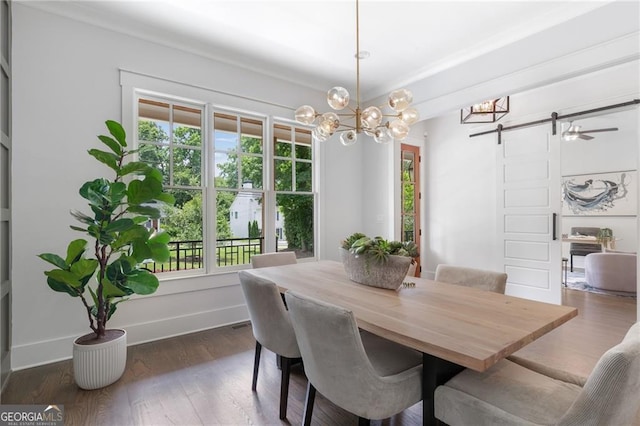2602 Drew Valley Rd NE, Brookhaven, GA 30319 - dining room featuring a barn door, a chandelier, and dark wood-style flooring