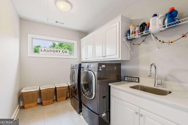 2377 Kesgrove Way, Buford, GA 30518 - washroom with cabinet space, washing machine and clothes dryer, and light tile patterned flooring