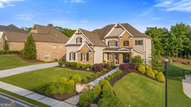 2377 Kesgrove Way, Buford, GA 30518 - view of front of home with stone siding, a standing seam roof, a metal roof, and a porch