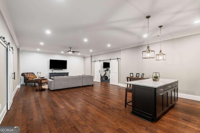 2377 Kesgrove Way, Buford, GA 30518 - living area featuring a barn door, recessed lighting, ceiling fan, and dark wood-style floors