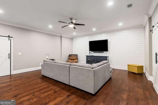 2377 Kesgrove Way, Buford, GA 30518 - living area featuring a barn door, ceiling fan, recessed lighting, crown molding, and dark wood-style floors