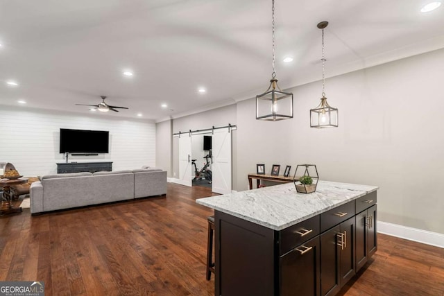 2377 Kesgrove Way, Buford, GA 30518 - kitchen featuring a barn door, recessed lighting, ceiling fan, dark wood finished floors, and a center island