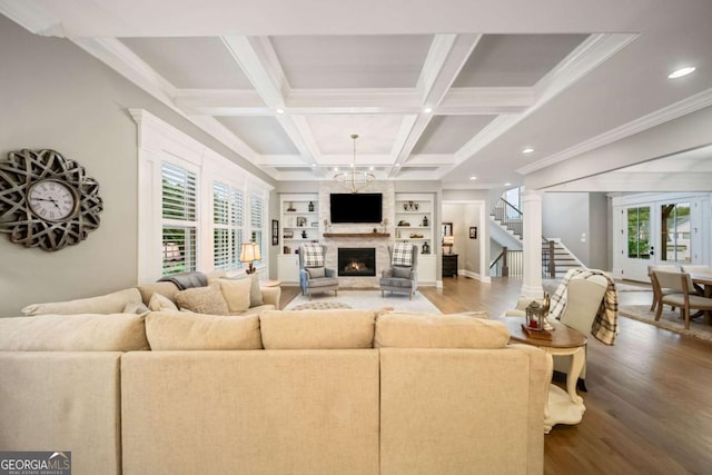 2377 Kesgrove Way, Buford, GA 30518 - living area with wood finished floors, a fireplace, stairway, healthy amount of natural light, and recessed lighting