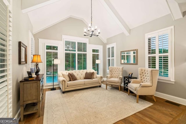 2377 Kesgrove Way, Buford, GA 30518 - living room with wood finished floors, a chandelier, and plenty of natural light