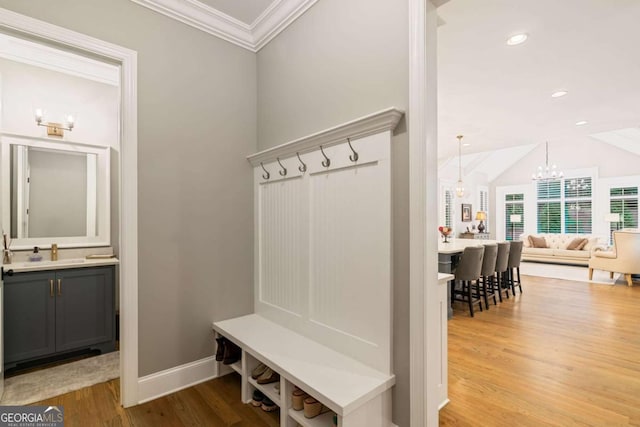 2377 Kesgrove Way, Buford, GA 30518 - mudroom with ornamental molding, wood finished floors, a chandelier, lofted ceiling, and recessed lighting